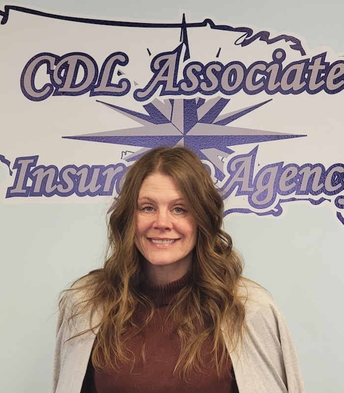 About Our Agency - CDL Associates Insurance Agency LLC Team Standing Together Looking at a Computer